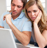 man and woman at a laptop