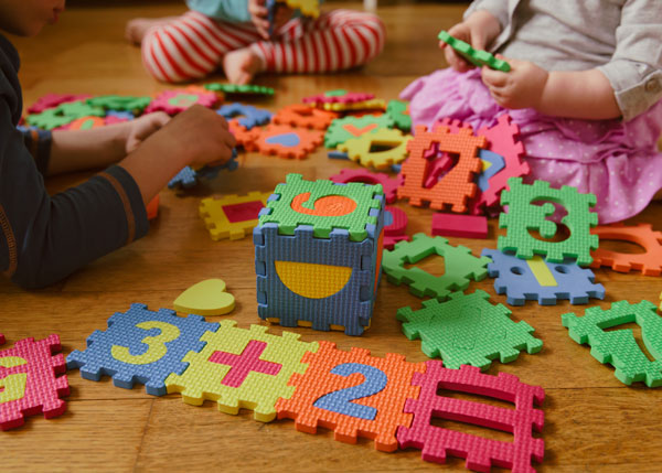 Children playing with number toys