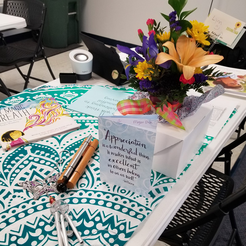 Flowers and card on a table.