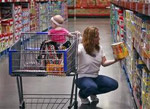 woman with a child grocery shopping