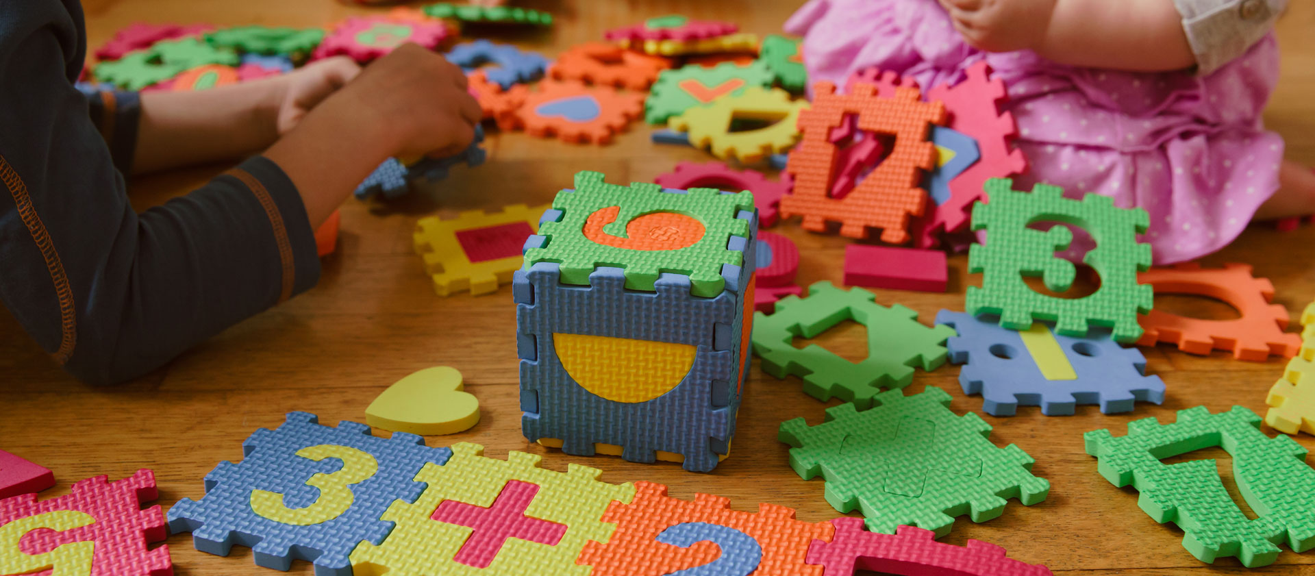 Block play with numbers scattered on the floor