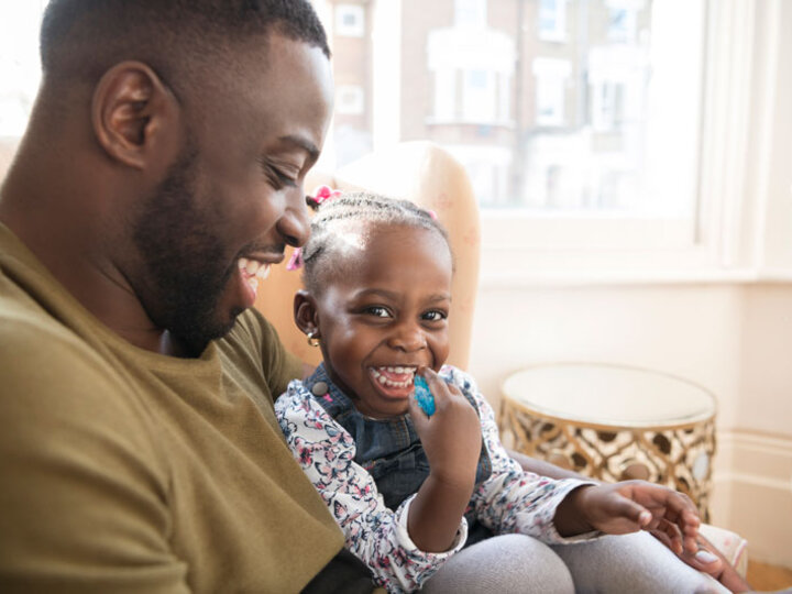 Father and child sitting together