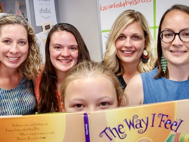 A group photo with book